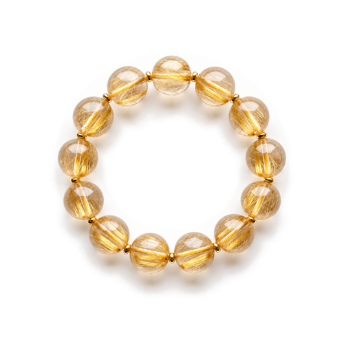 Golden Harvest rutilated quartz bracelet on a white background