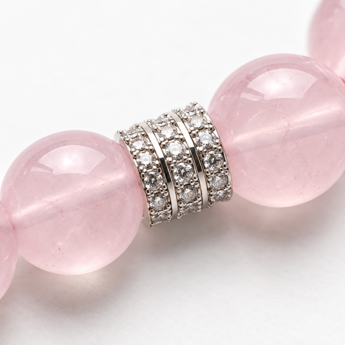 Close-up of Love in Bloom pink beads and silver-tone spacer
