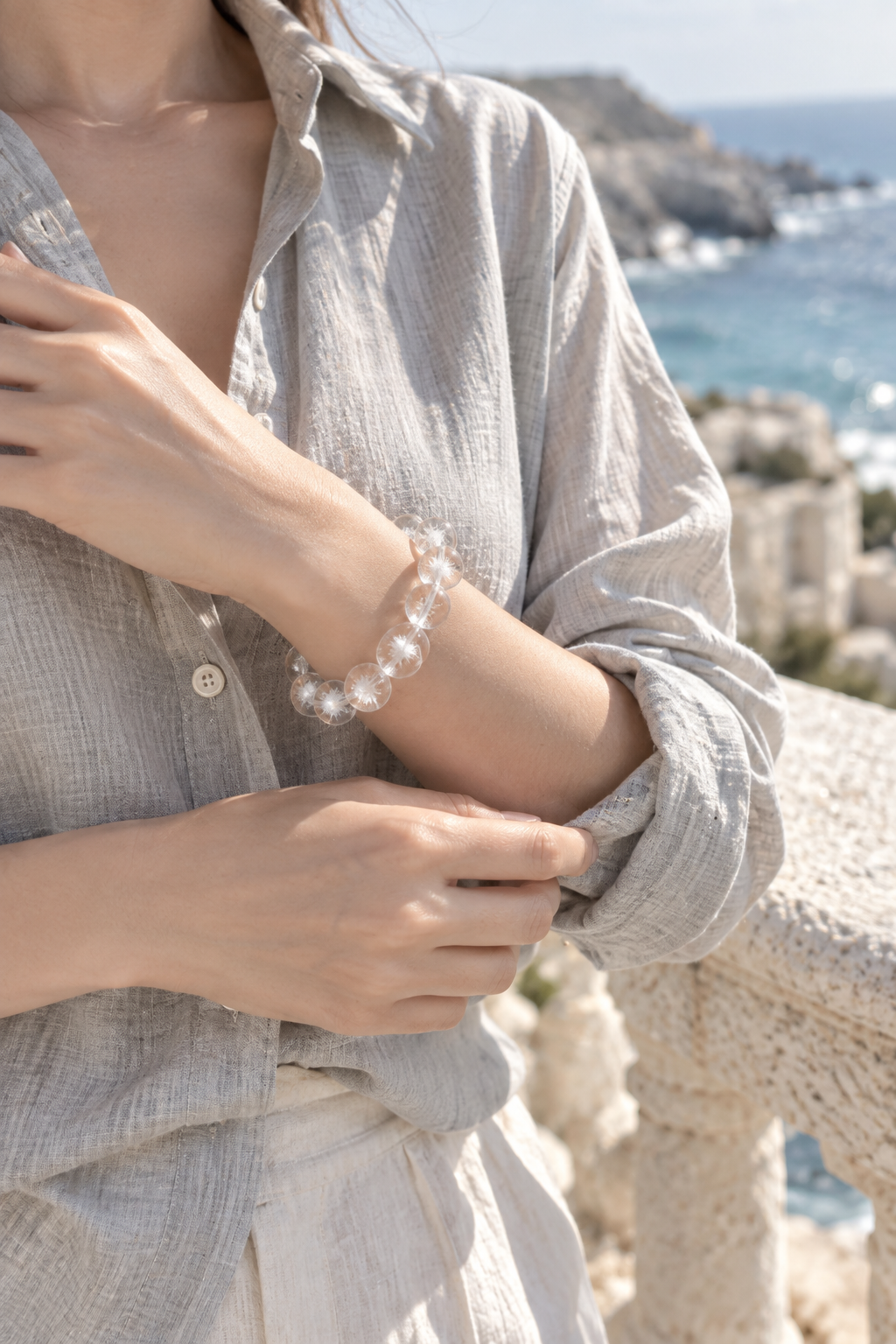 Tidal Bloom bracelet worn with a light linen shirt by the coast